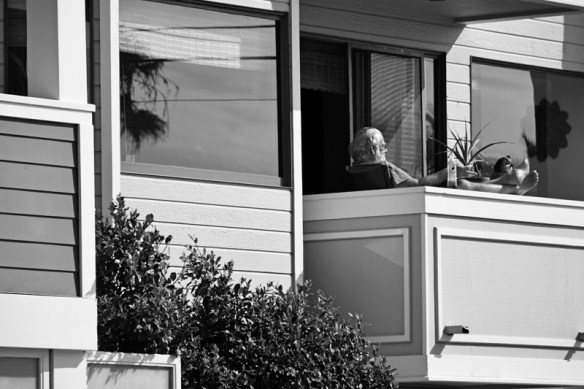 Talking business on the phone, feet up, soft drink...